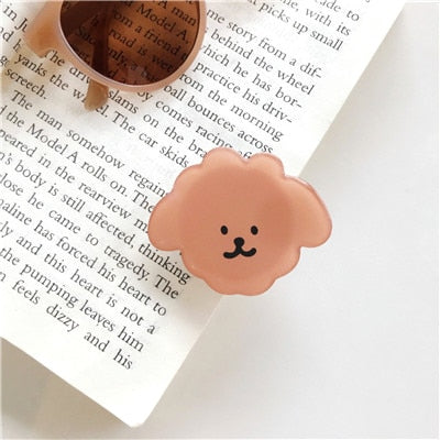Cartoon Dog Phone Socket. Attach these to your phone so you can hold it securely, prop it up whilst watching shows, or just fiddle around with it. Compatible with any phone!