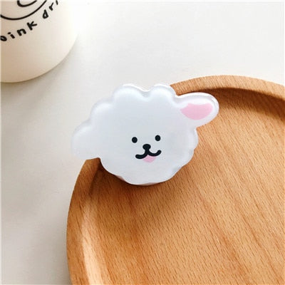 Cartoon Fulffy Dog Phone Socket. Attach these to your phone so you can hold it securely, prop it up whilst watching shows, or just fiddle around with it. Compatible with any phone!