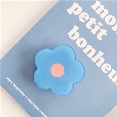 Cartoon Flower Phone Socket. Attach these to your phone so you can hold it securely, prop it up whilst watching shows, or just fiddle around with it. Compatible with any phone!
