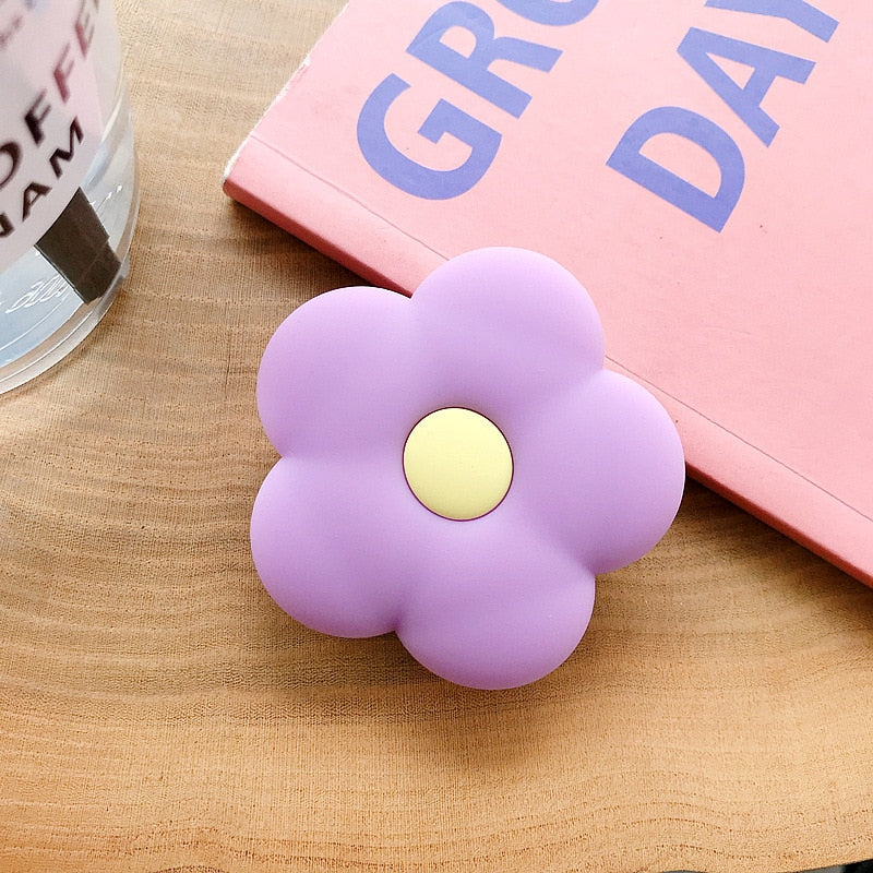 Cartoon Flower Phone Socket. Attach these to your phone so you can hold it securely, prop it up whilst watching shows, or just fiddle around with it. Compatible with any phone!