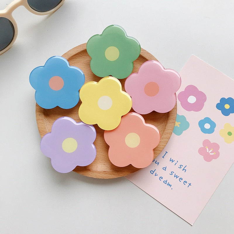 Cartoon Flower Phone Socket. Attach these to your phone so you can hold it securely, prop it up whilst watching shows, or just fiddle around with it. Compatible with any phone!