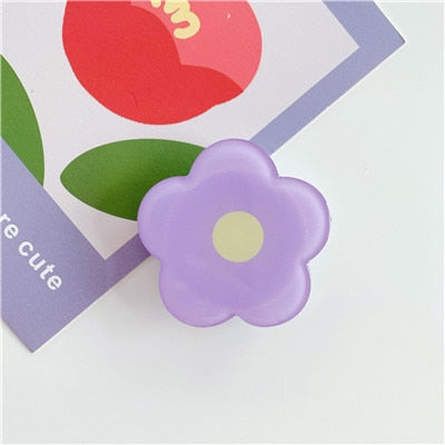 Cartoon Flower Phone Socket. Attach these to your phone so you can hold it securely, prop it up whilst watching shows, or just fiddle around with it. Compatible with any phone!