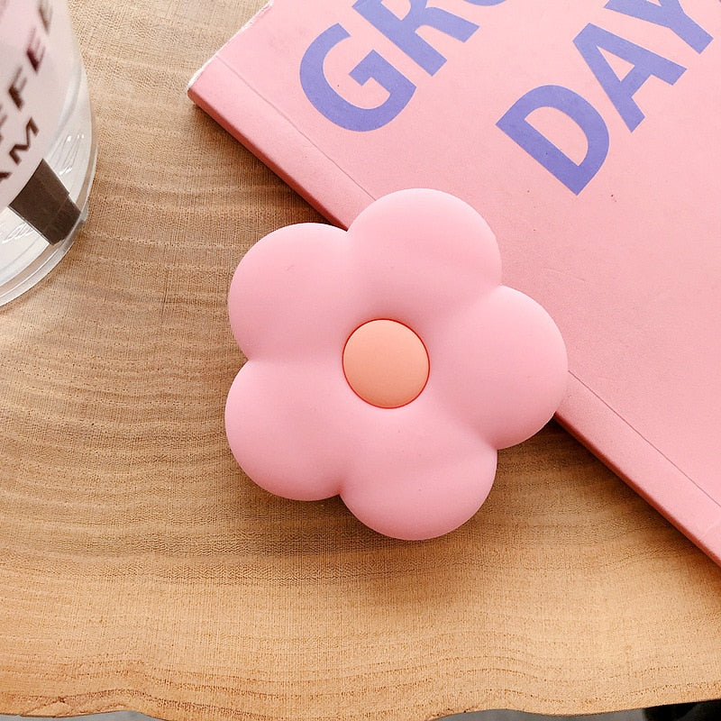 Cartoon Flower Phone Socket. Attach these to your phone so you can hold it securely, prop it up whilst watching shows, or just fiddle around with it. Compatible with any phone!
