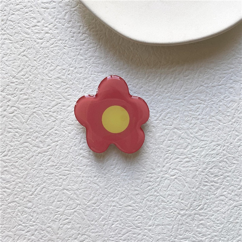 Cartoon Flower Phone Socket. Attach these to your phone so you can hold it securely, prop it up whilst watching shows, or just fiddle around with it. Compatible with any phone!