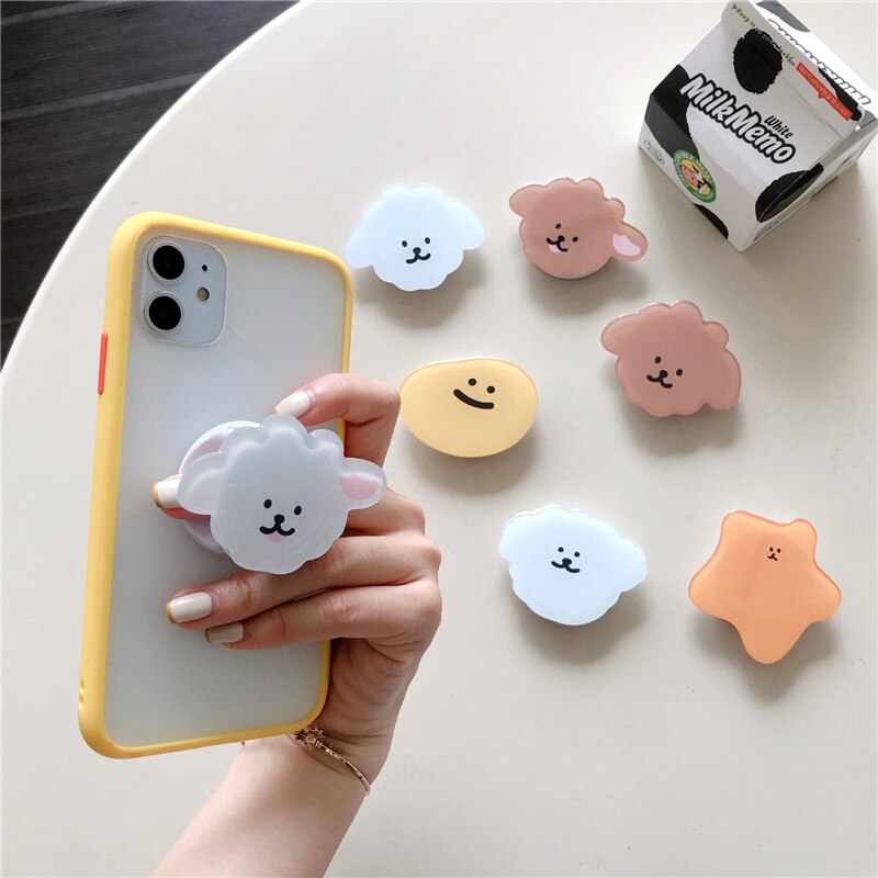 Cartoon Phone Socket. Attach these to your phone so you can hold it securely, prop it up whilst watching shows, or just fiddle around with it. Compatible with any phone!