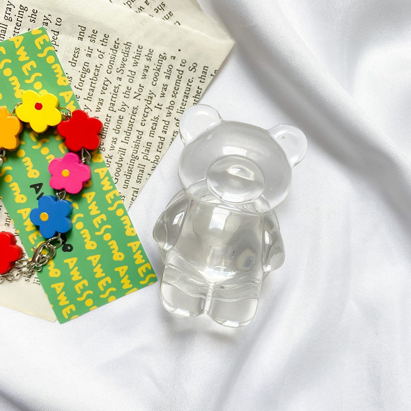 Phone Pop Socket Clear Bear. Griptok. Attach it to your phone so you can hold it securely, prop it up whilst watching shows, or just fiddle around with it. Compatible with any phone!