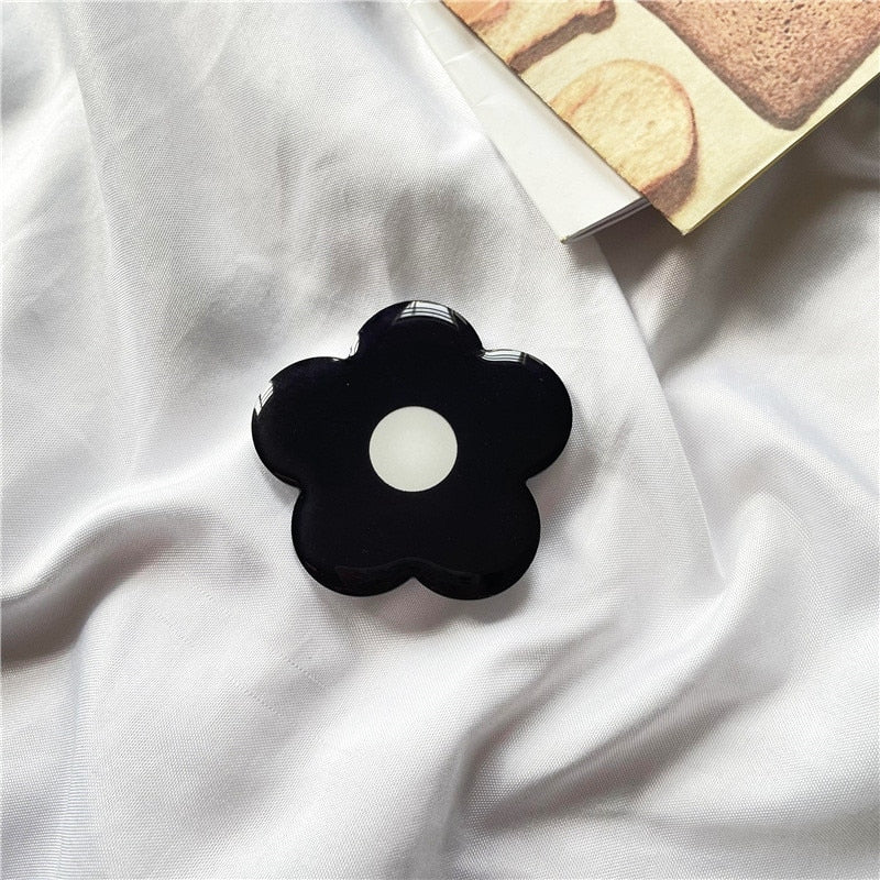 Cartoon Flower Phone Socket. Attach these to your phone so you can hold it securely, prop it up whilst watching shows, or just fiddle around with it. Compatible with any phone!