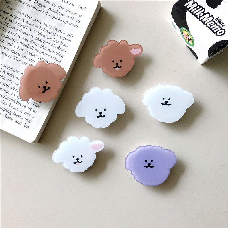 Cartoon Dog Collection Phone Socket. Attach these to your phone so you can hold it securely, prop it up whilst watching shows, or just fiddle around with it. Compatible with any phone!