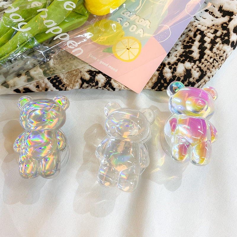 Phone Pop Socket Holographic Bear. Griptok. Attach it to your phone so you can hold it securely, prop it up whilst watching shows, or just fiddle around with it. Compatible with any phone!