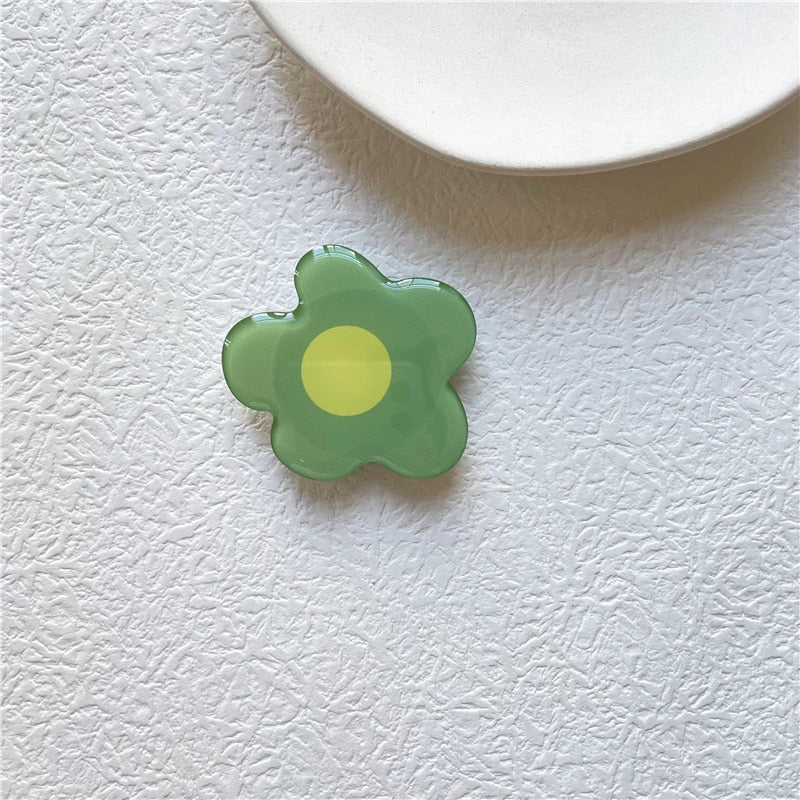 Cartoon Flower Phone Socket. Attach these to your phone so you can hold it securely, prop it up whilst watching shows, or just fiddle around with it. Compatible with any phone!