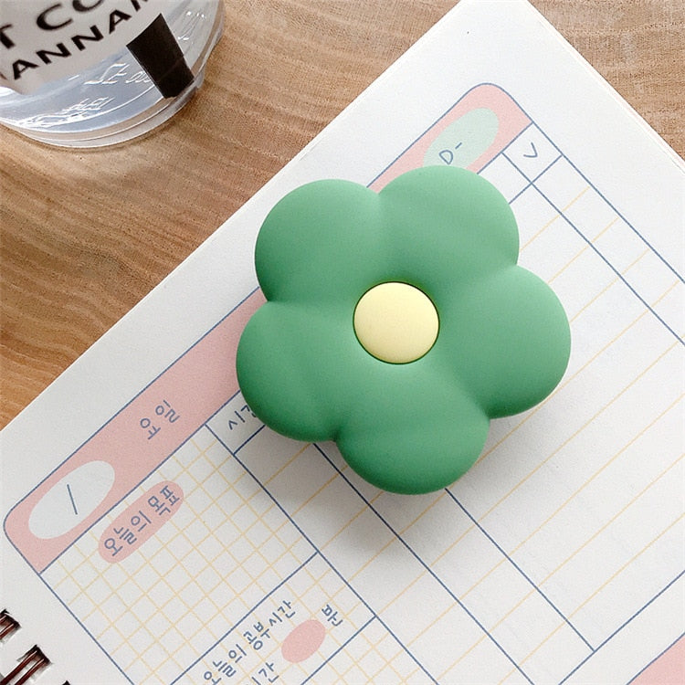 Cartoon Flower Phone Socket. Attach these to your phone so you can hold it securely, prop it up whilst watching shows, or just fiddle around with it. Compatible with any phone!