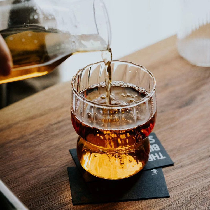 Curvy glass cup with vertical stripes, perfect size for your hands with a non-slip design, stackable shape. Heat resistant glass material too!