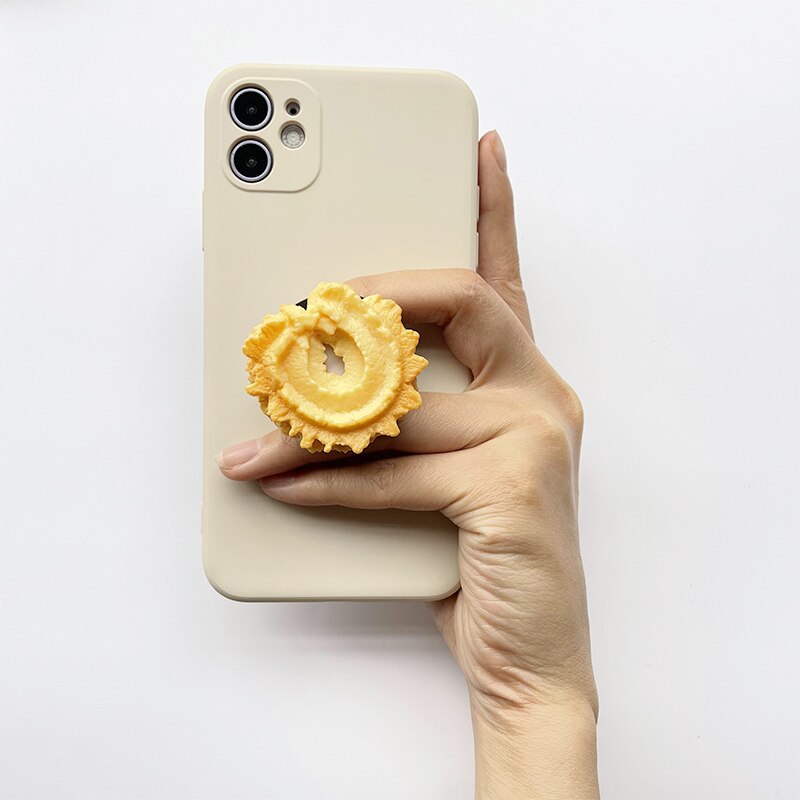 Phone Socket Danish Butter Cookies. Griptok. Attach it to your phone so you can hold it securely, prop it up whilst watching shows, or just fiddle around with it. Compatible with any phone!