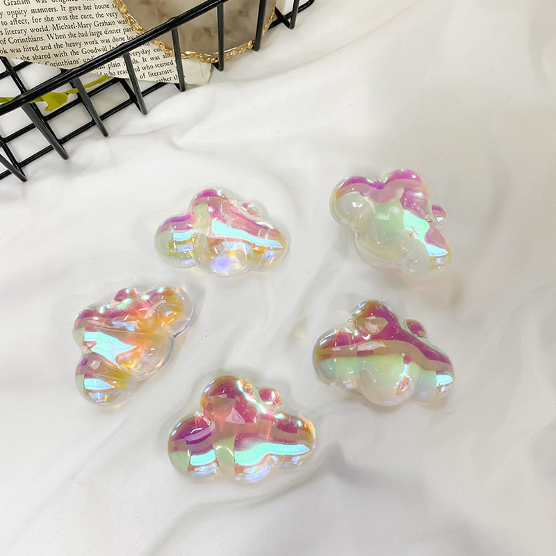 Holographic Clouds Phone Socket. Attach these to your phone so you can hold it securely, prop it up whilst watching shows, or just fiddle around with it. Compatible with any phone!