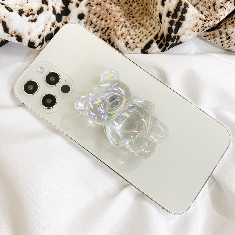 Phone Pop Socket Holographic Bear. Griptok. Attach it to your phone so you can hold it securely, prop it up whilst watching shows, or just fiddle around with it. Compatible with any phone!