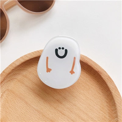Cartoon Snowman Phone Socket. Attach these to your phone so you can hold it securely, prop it up whilst watching shows, or just fiddle around with it.  Compatible with any phone!
