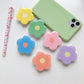 Cartoon Flower Phone Socket. Attach these to your phone so you can hold it securely, prop it up whilst watching shows, or just fiddle around with it.  Compatible with any phone!
