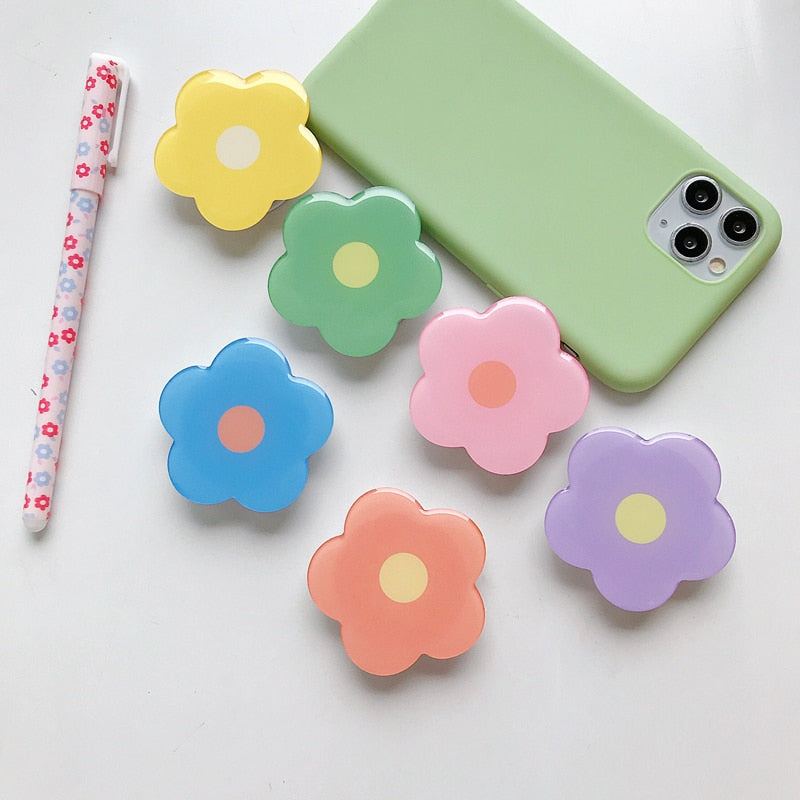 Cartoon Flower Phone Socket. Attach these to your phone so you can hold it securely, prop it up whilst watching shows, or just fiddle around with it.  Compatible with any phone!