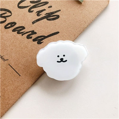 Cartoon Dog Phone Socket. Attach these to your phone so you can hold it securely, prop it up whilst watching shows, or just fiddle around with it.  Compatible with any phone!
