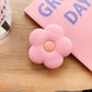 Cartoon Flower Phone Socket. Attach these to your phone so you can hold it securely, prop it up whilst watching shows, or just fiddle around with it.  Compatible with any phone!