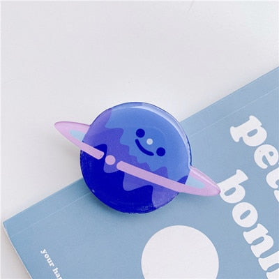 Cartoon Planet Jupiter Phone Socket. Attach these to your phone so you can hold it securely, prop it up whilst watching shows, or just fiddle around with it.  Compatible with any phone!
