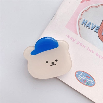 Cartoon Bear Phone Socket. Attach these to your phone so you can hold it securely, prop it up whilst watching shows, or just fiddle around with it.  Compatible with any phone!