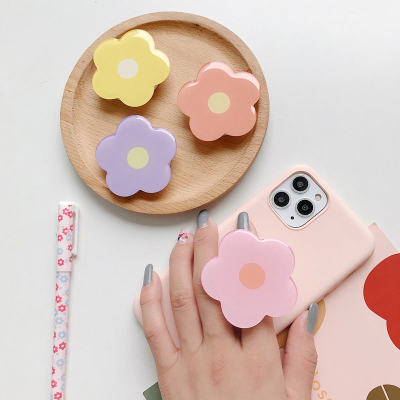 Cartoon Flower Phone Socket. Attach these to your phone so you can hold it securely, prop it up whilst watching shows, or just fiddle around with it.  Compatible with any phone!