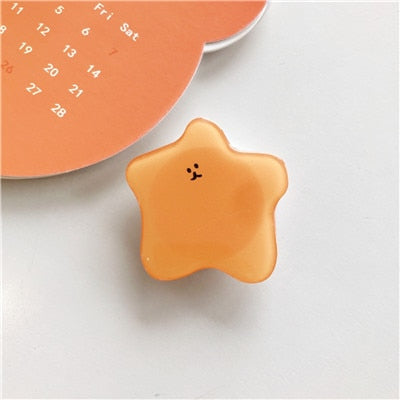 Cartoon Blob Phone Socket. Attach these to your phone so you can hold it securely, prop it up whilst watching shows, or just fiddle around with it.  Compatible with any phone!