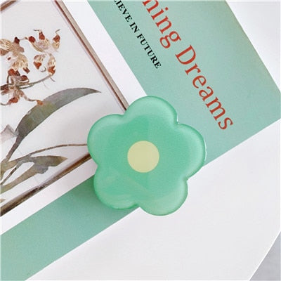 Cartoon Flower Phone Socket. Attach these to your phone so you can hold it securely, prop it up whilst watching shows, or just fiddle around with it.  Compatible with any phone!