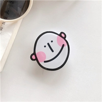 Cartoon Derp Man Phone Socket. Attach these to your phone so you can hold it securely, prop it up whilst watching shows, or just fiddle around with it.  Compatible with any phone!