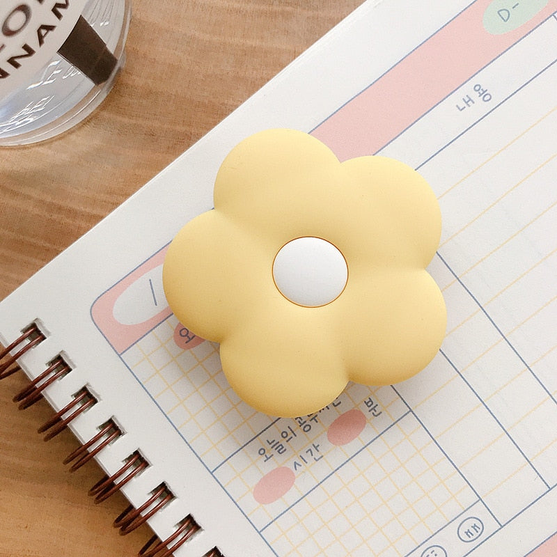 Cartoon Flower Phone Socket. Attach these to your phone so you can hold it securely, prop it up whilst watching shows, or just fiddle around with it.  Compatible with any phone!