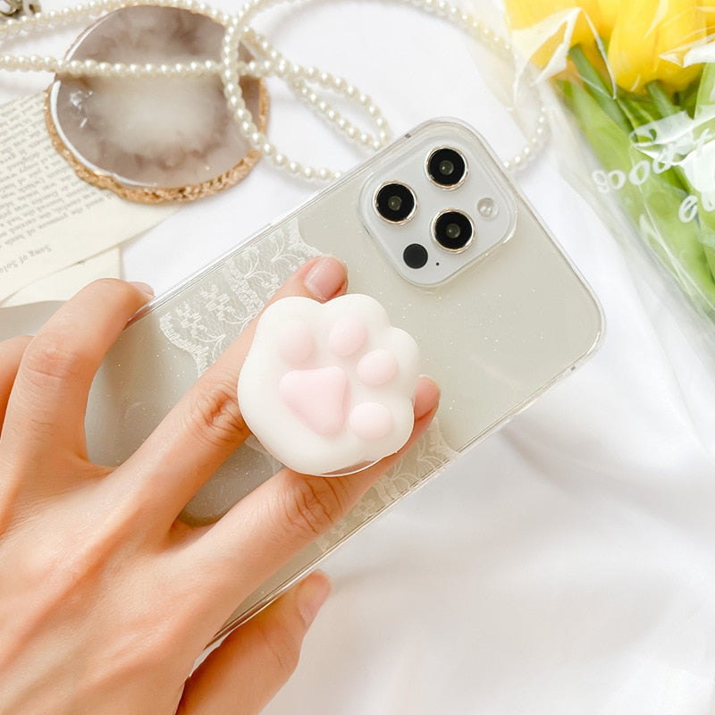 Chonky Cat Toe Bean Phone Socket. Griptok. Attach it to your phone so you can hold it securely, prop it up whilst watching shows, or just fiddle around with it. Compatible with any phone!