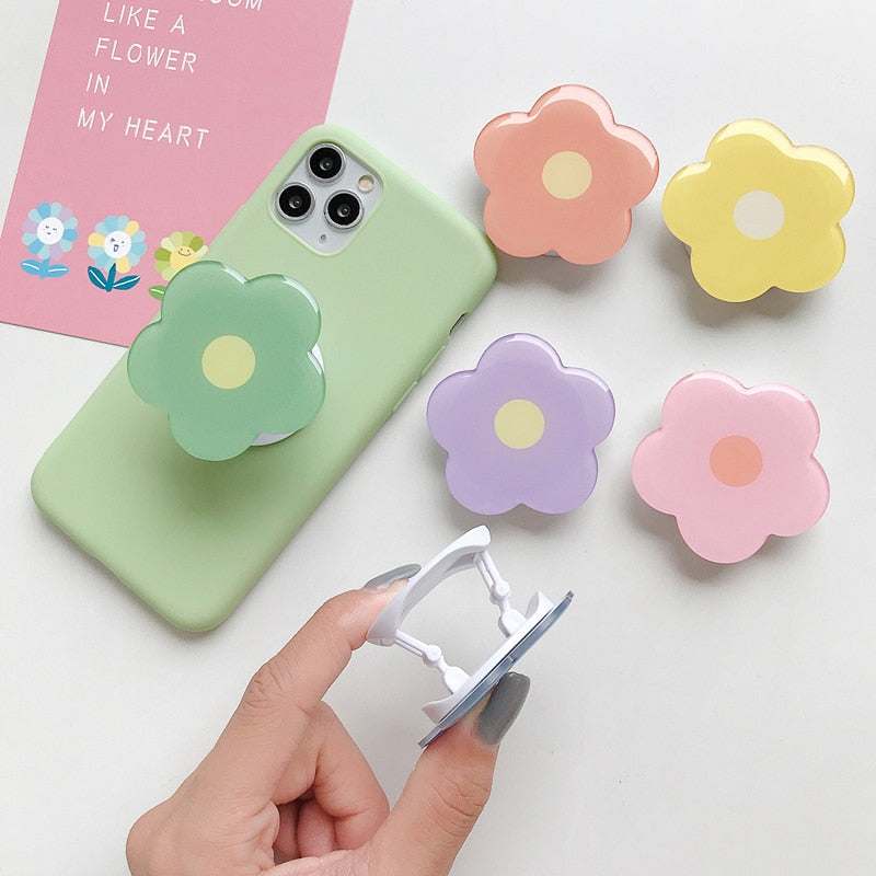 Cartoon Flower Phone Socket. Attach these to your phone so you can hold it securely, prop it up whilst watching shows, or just fiddle around with it.  Compatible with any phone!