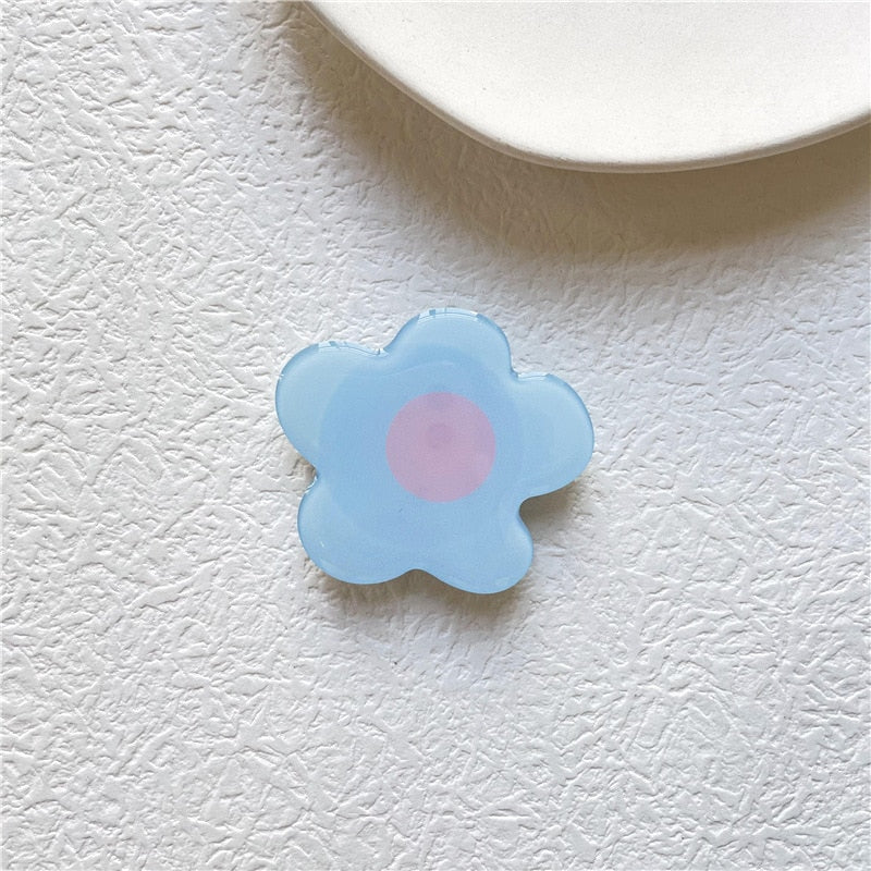 Cartoon Flower Phone Socket. Attach these to your phone so you can hold it securely, prop it up whilst watching shows, or just fiddle around with it.  Compatible with any phone!