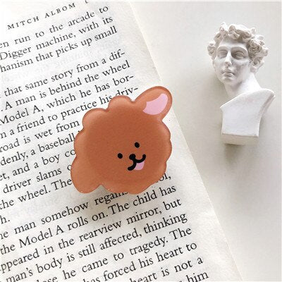 Cartoon Dog Phone Socket. Attach these to your phone so you can hold it securely, prop it up whilst watching shows, or just fiddle around with it.  Compatible with any phone!