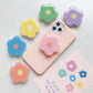 Cartoon Flower  Phone Socket. Attach these to your phone so you can hold it securely, prop it up whilst watching shows, or just fiddle around with it.  Compatible with any phone!