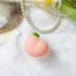 Chonky Peach Phone Socket. Griptok. Attach it to your phone so you can hold it securely, prop it up whilst watching shows, or just fiddle around with it. Compatible with any phone!