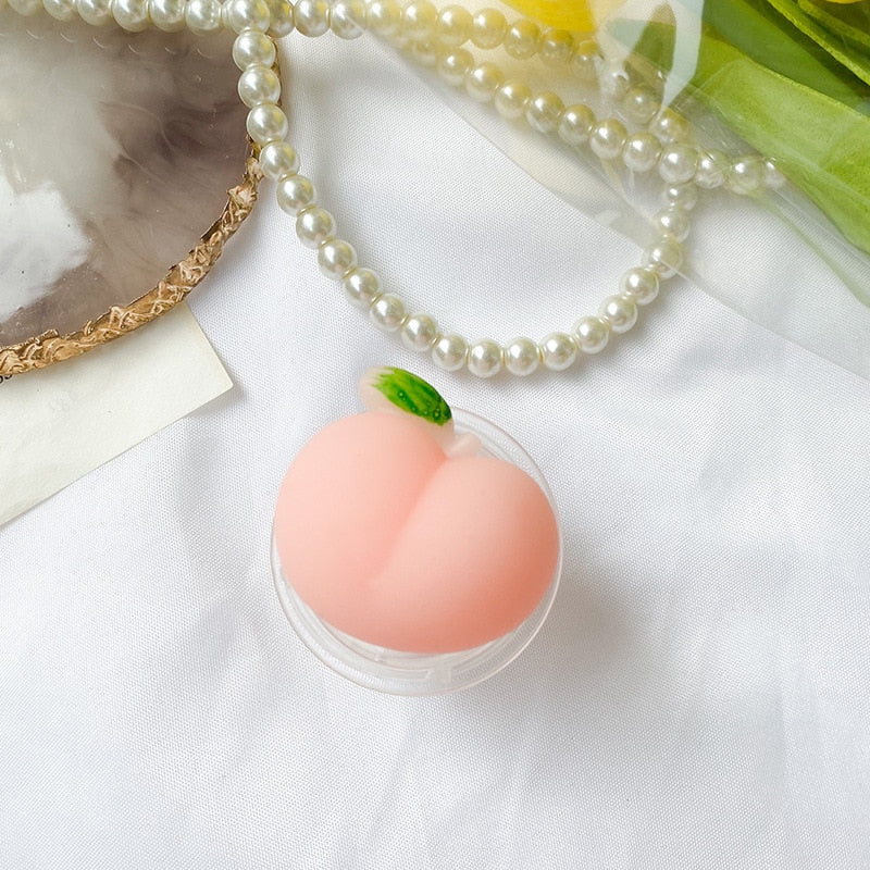 Chonky Peach Phone Socket. Griptok. Attach it to your phone so you can hold it securely, prop it up whilst watching shows, or just fiddle around with it. Compatible with any phone!