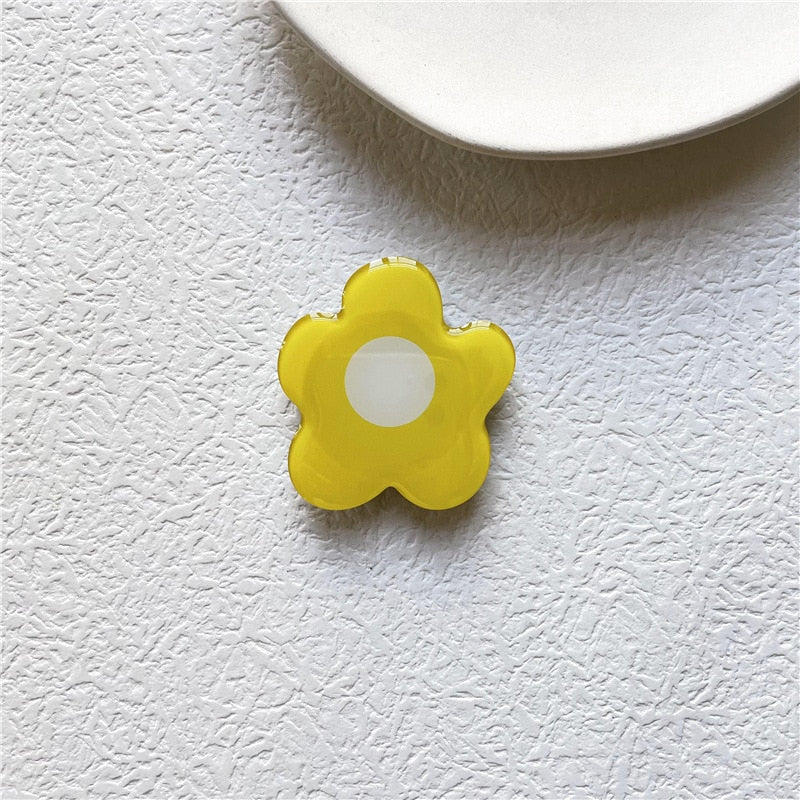 Cartoon Flower Phone Socket. Attach these to your phone so you can hold it securely, prop it up whilst watching shows, or just fiddle around with it.  Compatible with any phone!