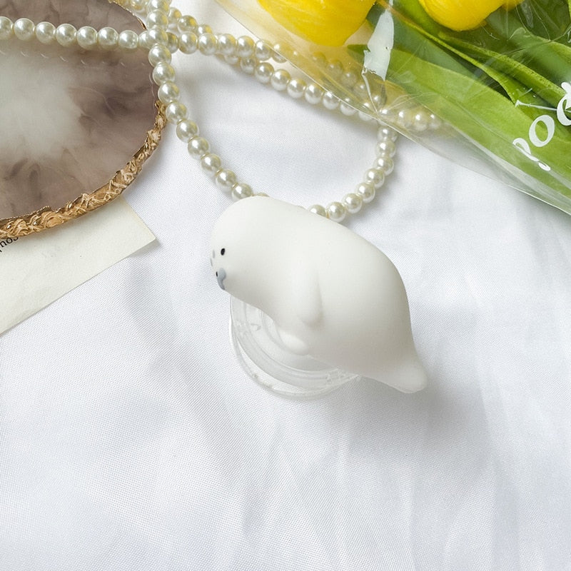 Fat Seal Chonky Phone Socket. Griptok. Attach it to your phone so you can hold it securely, prop it up whilst watching shows, or just fiddle around with it. Compatible with any phone!