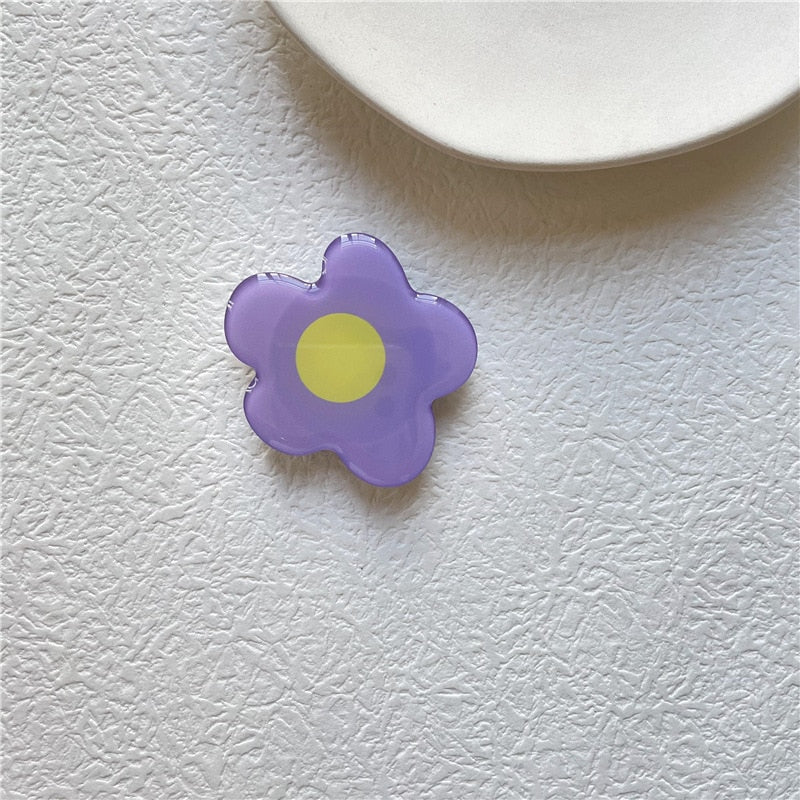 Cartoon Flower Phone Socket. Attach these to your phone so you can hold it securely, prop it up whilst watching shows, or just fiddle around with it.  Compatible with any phone!