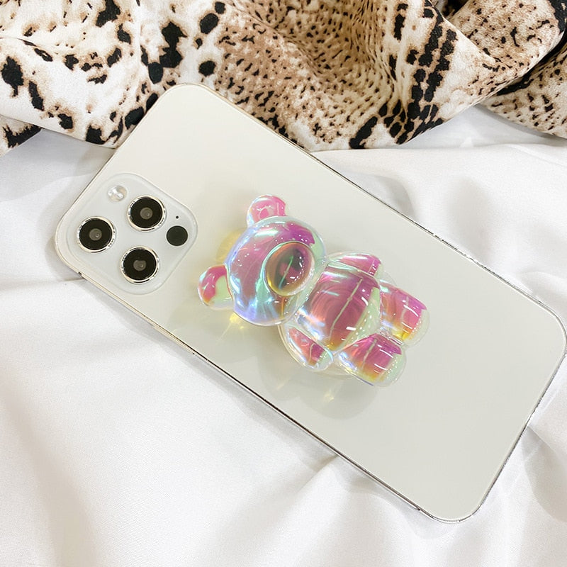 Phone Pop Socket Bear. Attach it to your phone so you can hold it securely, prop it up whilst watching shows, or just fiddle around with it. Compatible with any phone!