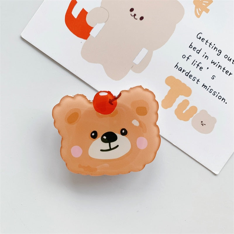 Cartoon Bear Phone Socket. Griptok. Attach it to your phone so you can hold it securely, prop it up whilst watching shows, or just fiddle around with it. Compatible with any phone!