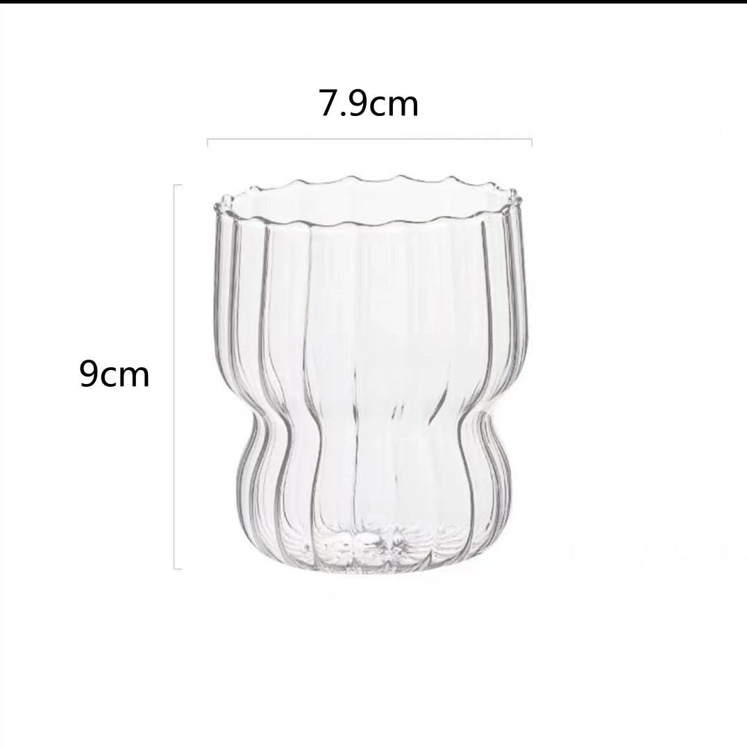 Curvy glass cup with vertical stripes, perfect size for your hands with a non-slip design, stackable shape. Heat resistant glass material too! 