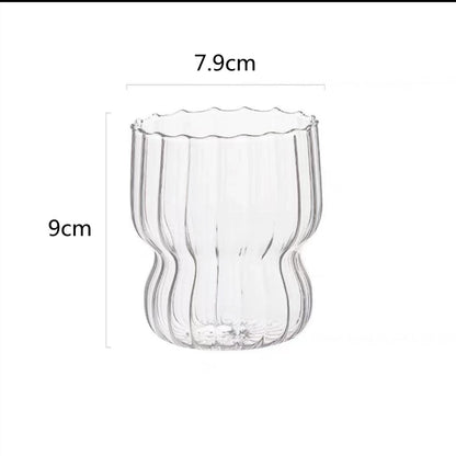 Curvy glass cup with vertical stripes, perfect size for your hands with a non-slip design, stackable shape. Heat resistant glass material too! 