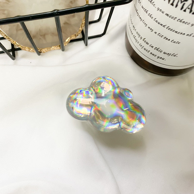 Holographic Clouds Phone Socket. Attach these to your phone so you can hold it securely, prop it up whilst watching shows, or just fiddle around with it.  Compatible with any phone!