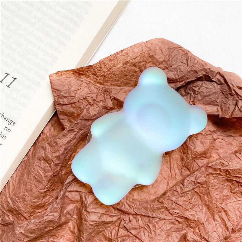 Phone Pop Socket Blue Matte Bear. Griptok. Attach it to your phone so you can hold it securely, prop it up whilst watching shows, or just fiddle around with it. Compatible with any phone!