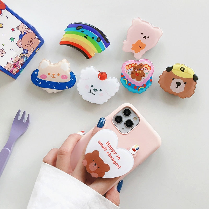 Cartoon Phone Socket. Griptok. Attach it to your phone so you can hold it securely, prop it up whilst watching shows, or just fiddle around with it. Compatible with any phone!