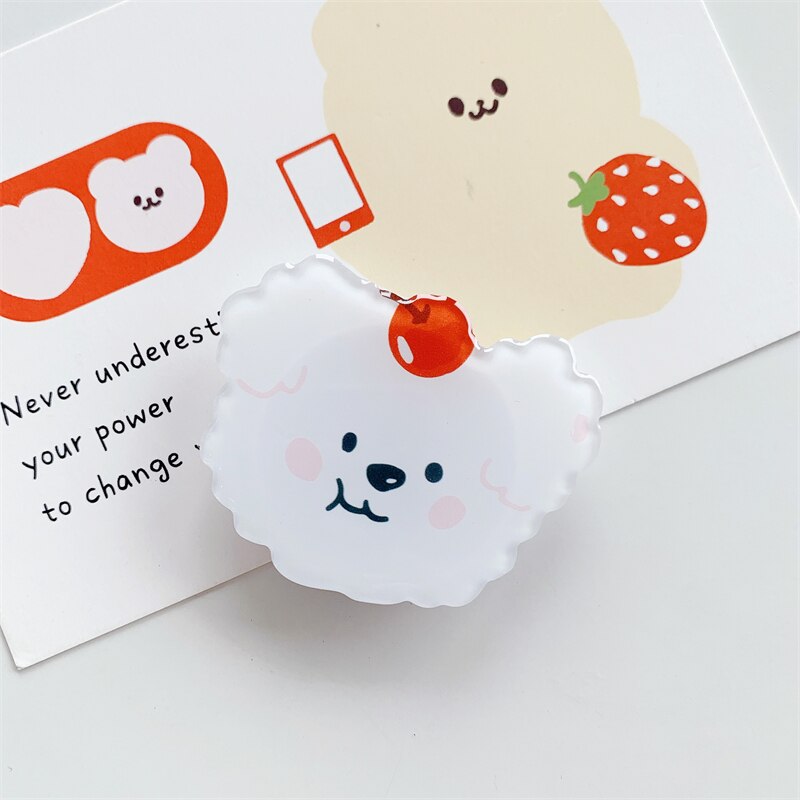 Fluffy Dog Cartoon Phone Socket. Griptok. Attach it to your phone so you can hold it securely, prop it up whilst watching shows, or just fiddle around with it. Compatible with any phone!