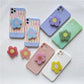 Cartoon Flower Phone Socket. Attach these to your phone so you can hold it securely, prop it up whilst watching shows, or just fiddle around with it.  Compatible with any phone!